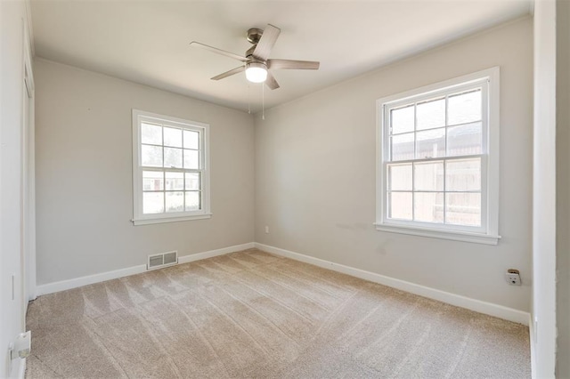 2424 Ashley Dr, The Village, OK 73120 - carpeted spare room with plenty of natural light, a ceiling fan, and baseboards