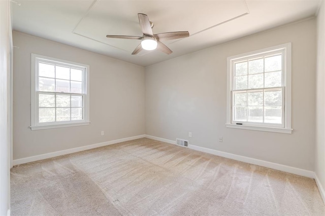 2424 Ashley Dr, The Village, OK 73120 - carpeted empty room featuring healthy amount of natural light, baseboards, and a ceiling fan