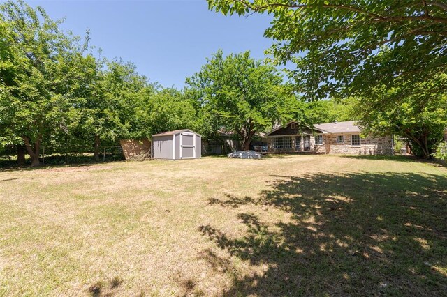 2424 Ashley Dr, The Village, OK 73120 - view of yard featuring a storage shed and an outbuilding