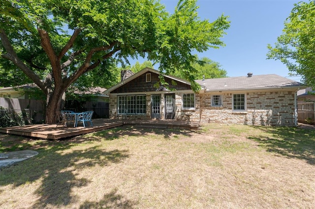 2424 Ashley Dr, The Village, OK 73120 - back of property with a deck, stone siding, and a chimney