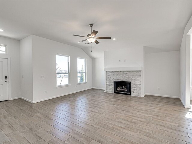 1121 Acacia Creek Dr, Yukon, OK 73099 - unfurnished living room featuring a ceiling fan, light wood-style flooring, a fireplace, baseboards, and recessed lighting
