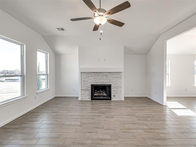1121 Acacia Creek Dr, Yukon, OK 73099 - unfurnished living room with lofted ceiling, ceiling fan, light wood-type flooring, a fireplace, and baseboards