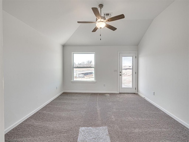 1121 Acacia Creek Dr, Yukon, OK 73099 - carpeted empty room with vaulted ceiling, ceiling fan, and baseboards