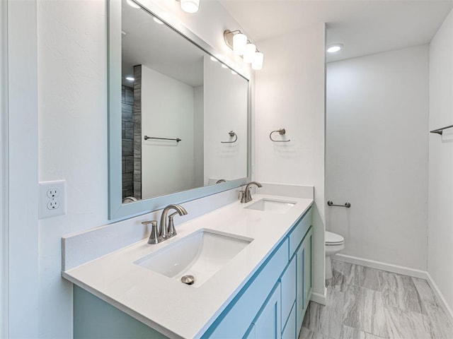 1121 Acacia Creek Dr, Yukon, OK 73099 - full bath featuring toilet, marble finish flooring, double vanity, and baseboards