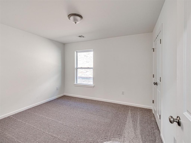 1121 Acacia Creek Dr, Yukon, OK 73099 - spare room featuring carpet and baseboards