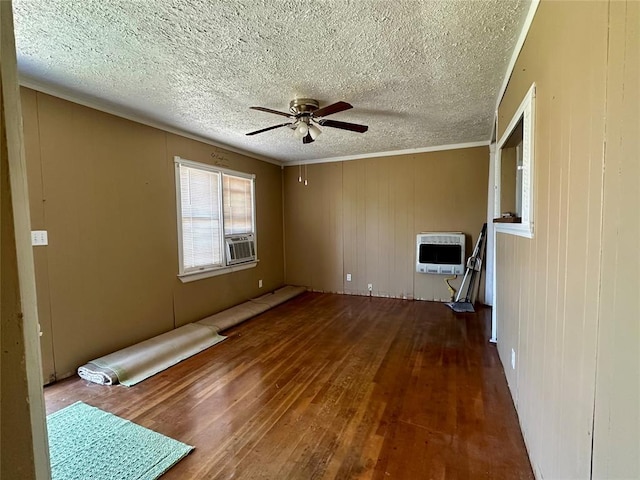 1137 E Chestnut St, Altus, OK 73521 - empty room featuring hardwood / wood-style floors, a ceiling fan, heating unit, a textured ceiling, and cooling unit