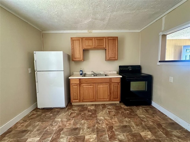 1137 E Chestnut St, Altus, OK 73521 - kitchen with freestanding refrigerator, black electric range, a textured ceiling, a sink, and light countertops