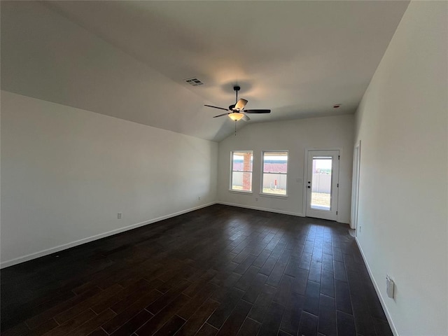 18121 Austin Ct, Edmond, OK 73012 - empty room with ceiling fan, dark wood-type flooring, baseboards, and vaulted ceiling