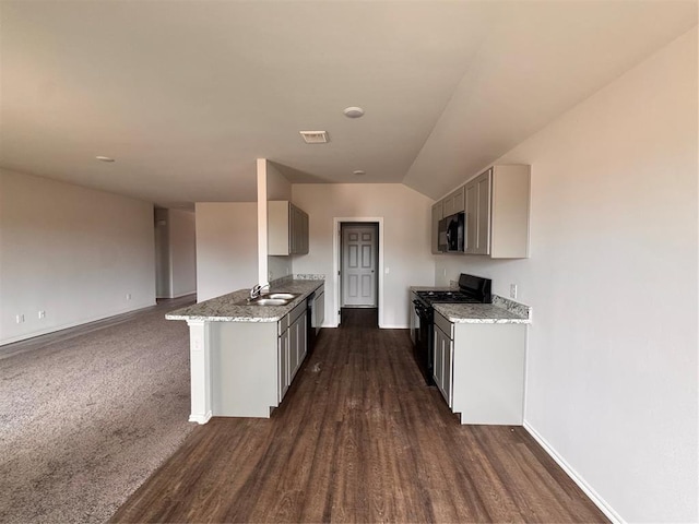 1204 E Stetson Ln, Mustang, OK 73064 - kitchen featuring black appliances, a sink, baseboards, dark wood finished floors, and gray cabinets