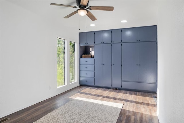 unfurnished bedroom featuring wood finished floors, recessed lighting, baseboards, and a ceiling fan
