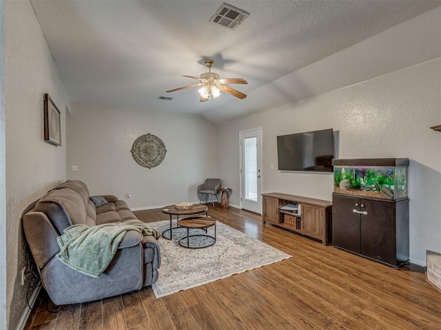2009 Astoria Dr, Moore, OK 73160 - living room with ceiling fan, wood finished floors, vaulted ceiling, and baseboards