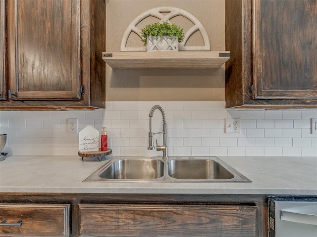 2009 Astoria Dr, Moore, OK 73160 - kitchen with a sink, dark brown cabinets, decorative backsplash, and light countertops
