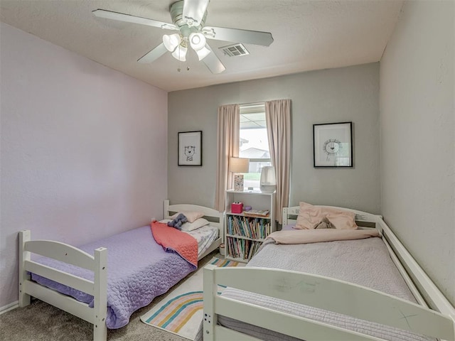 2009 Astoria Dr, Moore, OK 73160 - bedroom with ceiling fan, carpet flooring, and baseboards