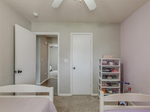2009 Astoria Dr, Moore, OK 73160 - carpeted bedroom featuring a ceiling fan and baseboards