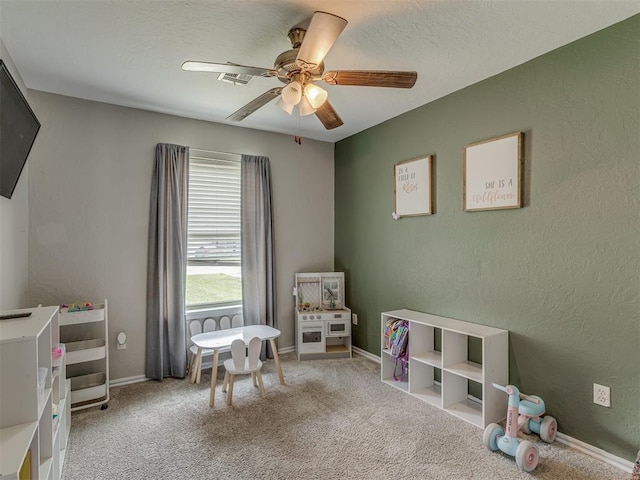 2009 Astoria Dr, Moore, OK 73160 - rec room featuring a ceiling fan, carpet floors, baseboards, and a textured ceiling