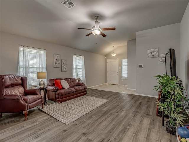 9120 SW 46th St, Oklahoma City, OK 73179 - living room featuring light wood finished floors, lofted ceiling, ceiling fan, and baseboards