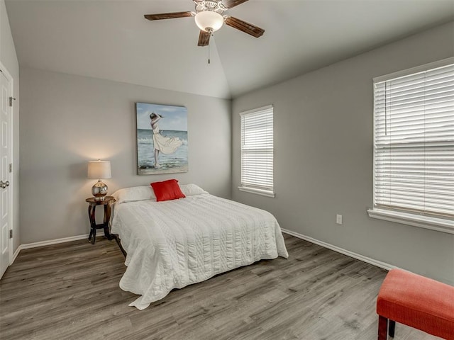9120 SW 46th St, Oklahoma City, OK 73179 - bedroom featuring wood finished floors, baseboards, vaulted ceiling, and a ceiling fan