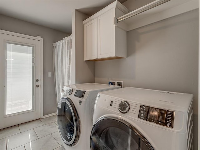 9120 SW 46th St, Oklahoma City, OK 73179 - laundry room with washer and clothes dryer, cabinet space, light tile patterned floors, and baseboards