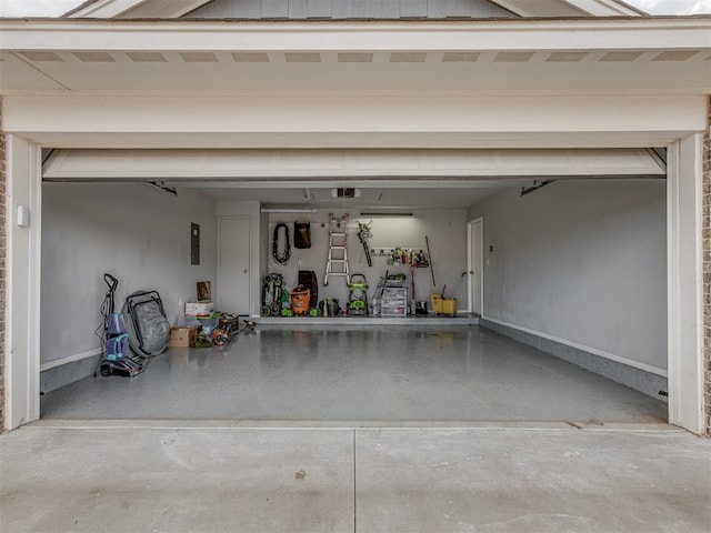 9120 SW 46th St, Oklahoma City, OK 73179 - garage with electric panel, a garage door opener, and baseboards