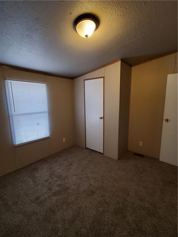 16110 Kings Rd, Shawnee, OK 74801 - carpeted empty room with a textured ceiling