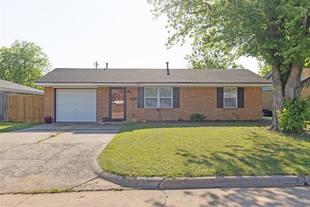 711 Spruce Dr, Yukon, OK 73099 - single story home featuring an attached garage, brick siding, and concrete driveway