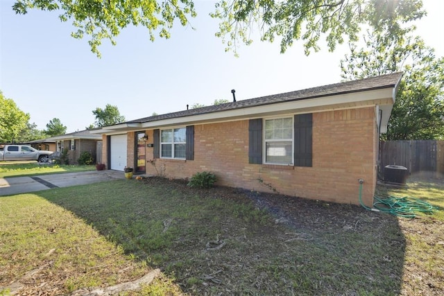 711 Spruce Dr, Yukon, OK 73099 - ranch-style home featuring an attached garage, driveway, and brick siding