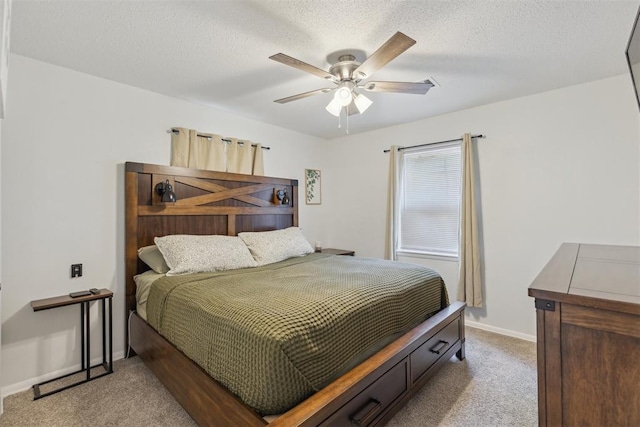 711 Spruce Dr, Yukon, OK 73099 - bedroom featuring carpet, baseboards, a ceiling fan, and a textured ceiling