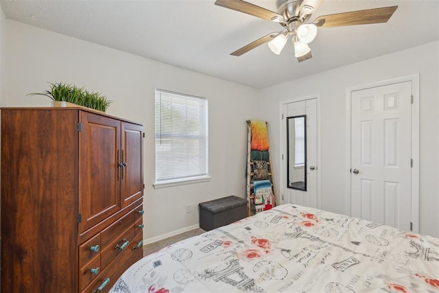 711 Spruce Dr, Yukon, OK 73099 - bedroom featuring baseboards, carpet, and a ceiling fan