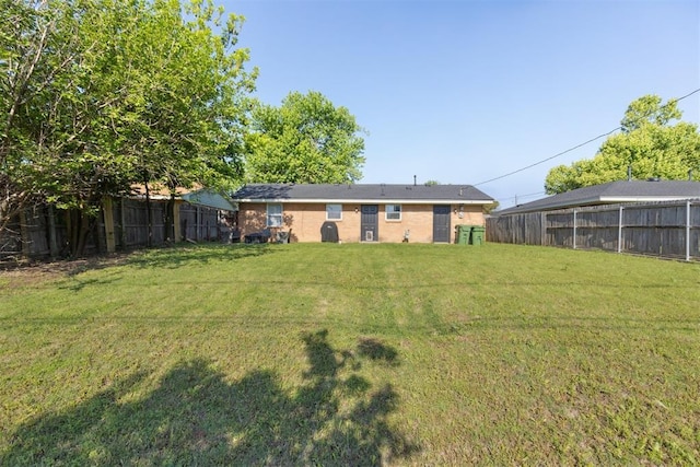 711 Spruce Dr, Yukon, OK 73099 - rear view of house with brick siding