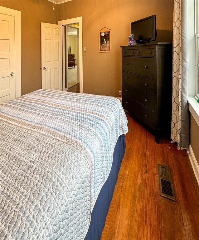 bedroom featuring wood finished floors
