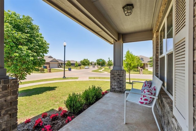 3432 Piney River Dr, Yukon, OK 73099 - view of patio / terrace with a porch and a residential view