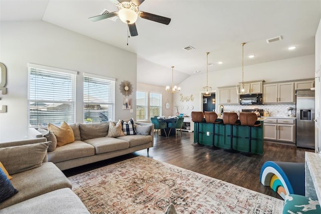 3432 Piney River Dr, Yukon, OK 73099 - living area with lofted ceiling, dark wood-style floors, ceiling fan, a chandelier, and recessed lighting