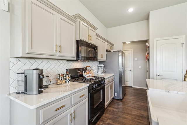 3432 Piney River Dr, Yukon, OK 73099 - kitchen featuring black appliances, tasteful backsplash, dark wood-type flooring, light stone countertops, and recessed lighting