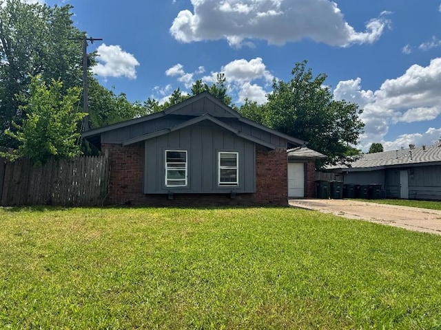 3316 Beechwood Dr, Del City, OK 73115 - view of front of property featuring board and batten siding, brick siding, and driveway