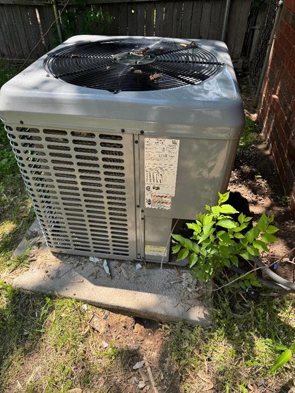 3316 Beechwood Dr, Del City, OK 73115 - exterior view of cooling unit and fence