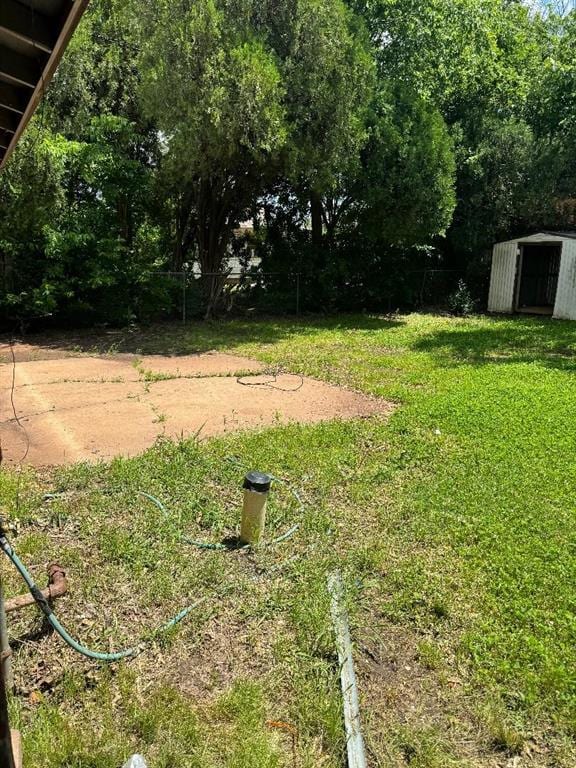 3316 Beechwood Dr, Del City, OK 73115 - view of green lawn featuring a shed and an outbuilding
