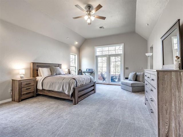 bedroom with lofted ceiling, access to outside, light carpet, a ceiling fan, and a textured ceiling