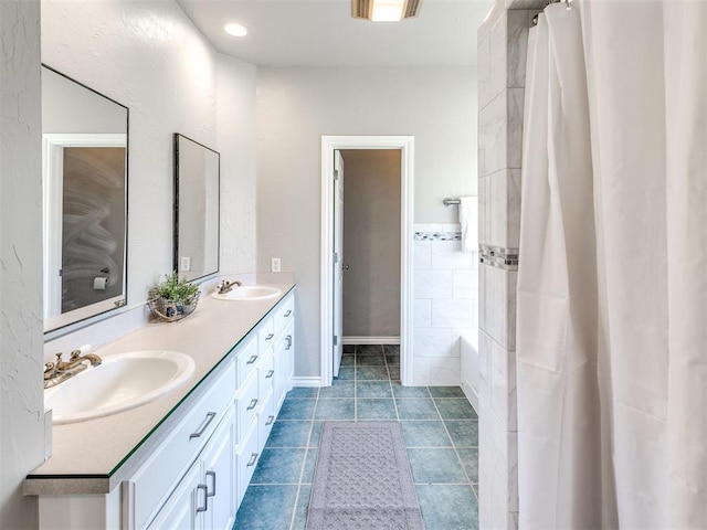 bathroom featuring double vanity, tile patterned flooring, curtained shower, and a tub to relax in