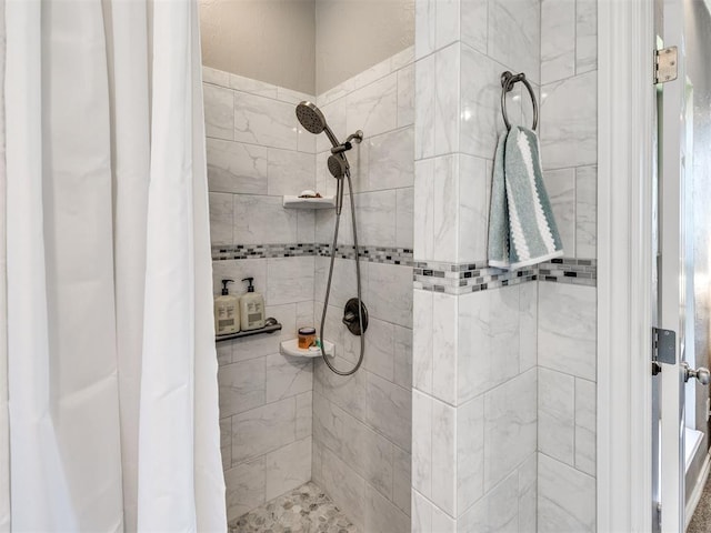 full bath featuring tiled shower