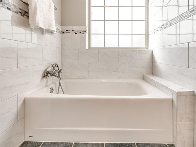 full bathroom with a tub