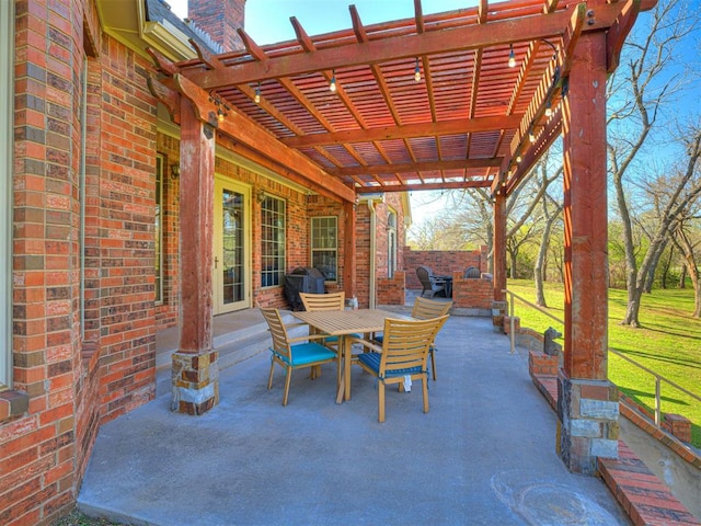 view of patio featuring outdoor dining space and a pergola