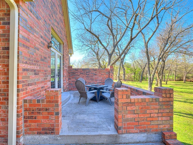 view of patio / terrace with an outdoor fire pit