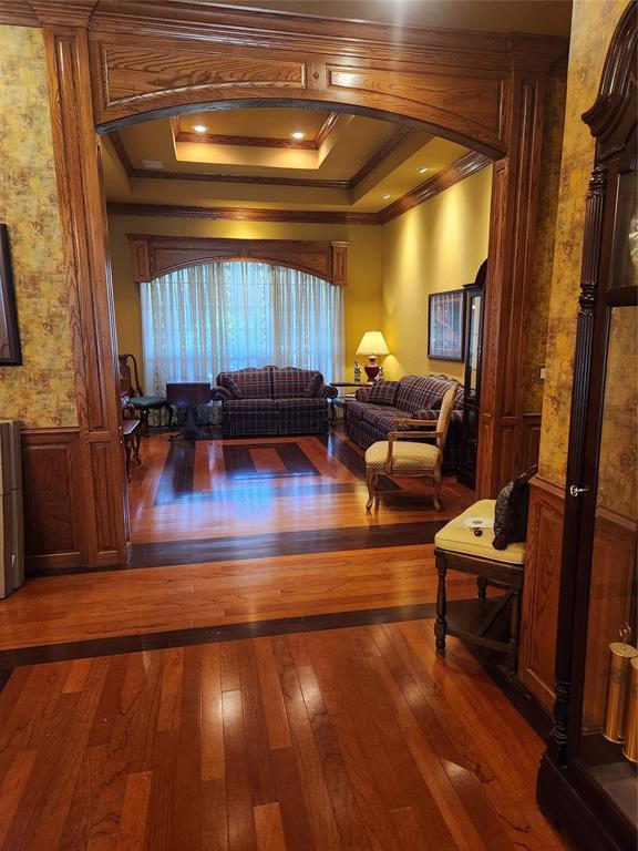 11301 Brockton Pl, Oklahoma City, OK 73162 - living area with ornamental molding and hardwood / wood-style floors