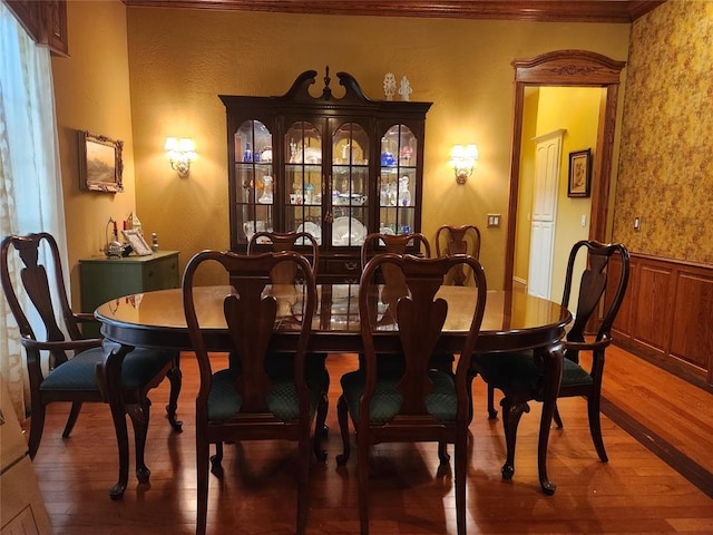 11301 Brockton Pl, Oklahoma City, OK 73162 - dining area with wood-type flooring, ornamental molding, and wainscoting