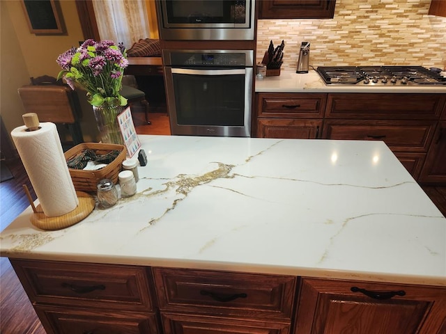 11301 Brockton Pl, Oklahoma City, OK 73162 - kitchen with stainless steel appliances, light stone countertops, and tasteful backsplash