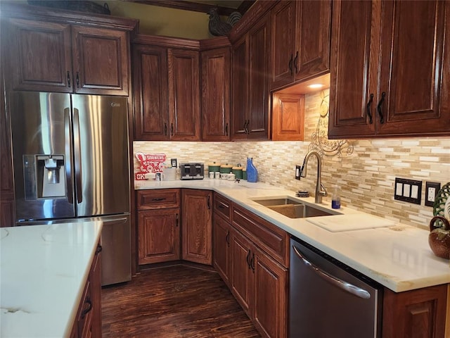 11301 Brockton Pl, Oklahoma City, OK 73162 - kitchen with appliances with stainless steel finishes, a sink, light countertops, backsplash, and dark wood-style floors