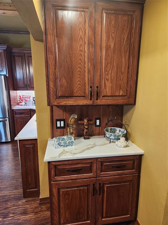 11301 Brockton Pl, Oklahoma City, OK 73162 - kitchen featuring freestanding refrigerator, dark wood-style flooring, and light countertops