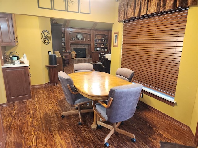 11301 Brockton Pl, Oklahoma City, OK 73162 - dining area featuring a fireplace and dark wood finished floors