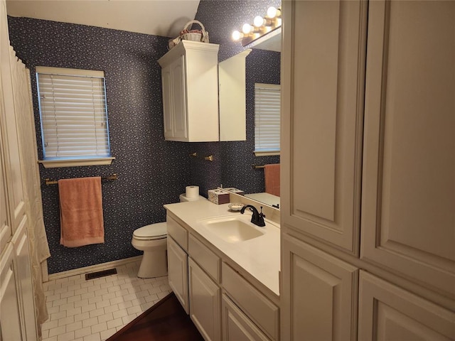 11301 Brockton Pl, Oklahoma City, OK 73162 - bathroom with wallpapered walls, toilet, vanity, and tile patterned floors