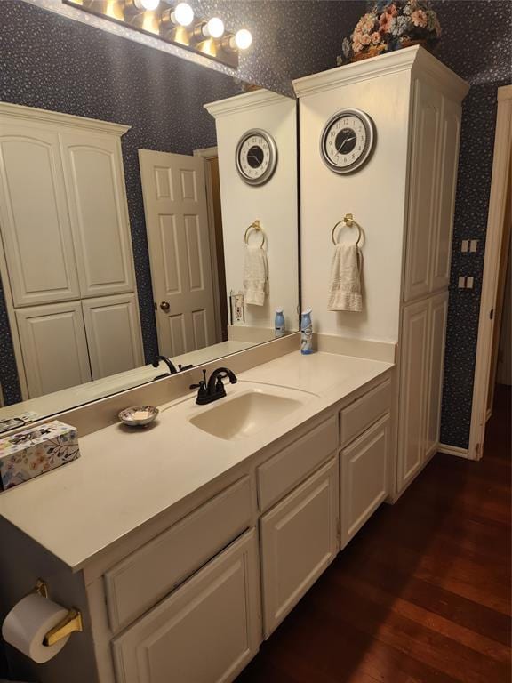 11301 Brockton Pl, Oklahoma City, OK 73162 - bathroom with wallpapered walls, wood finished floors, and vanity